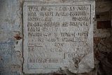 Каменная плита с надписью в историческом ансамбле. Фотоальбом 12 июня 2024 года; точное помещение и полная расшифровка требуют уточнения.